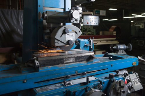 Precision grinding machining with sparks in workshop
