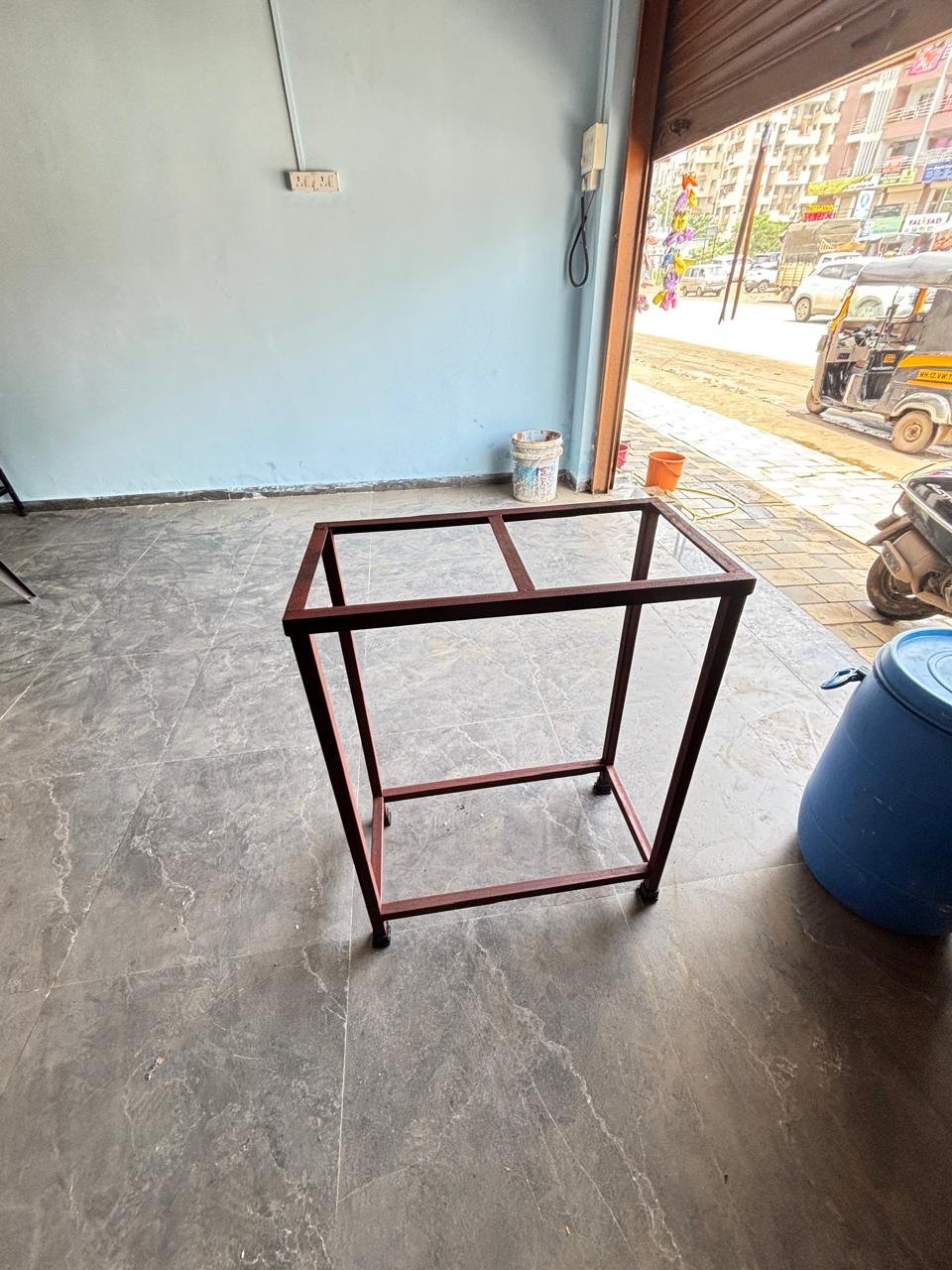Fabricator welding a steel frame on site